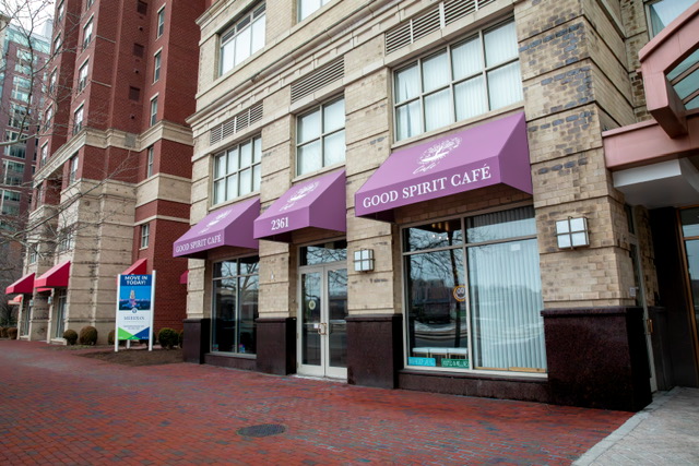The Good Spirit Café storefront with its purple awnings on Eisenhower Avenue